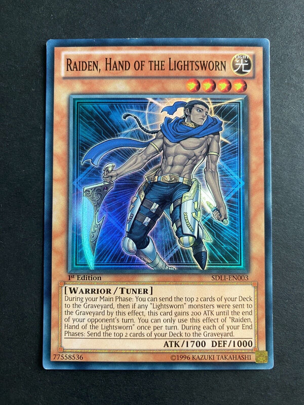 Yugioh Raiden, Hand of the Lightsworn SDLI-EN003 Super Rare 1st Edition LP