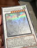 Yugioh Stardust Dragon TDGS-EN040 Ghost Rare Unlimited Edition DAMAGED - See pic