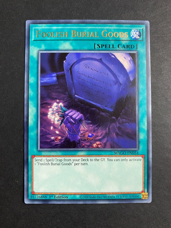Yugioh Foolish Burial Goods MAGO-EN054 Rare 1st Edition NM