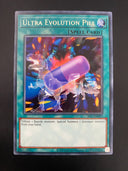 Yugioh Ultra Evolution Pill IOC-EN097 Rare Unlimited Edition NM/MINT