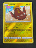 Pokemon Stunfish 67/236 Unified Minds Reverse Holo NM