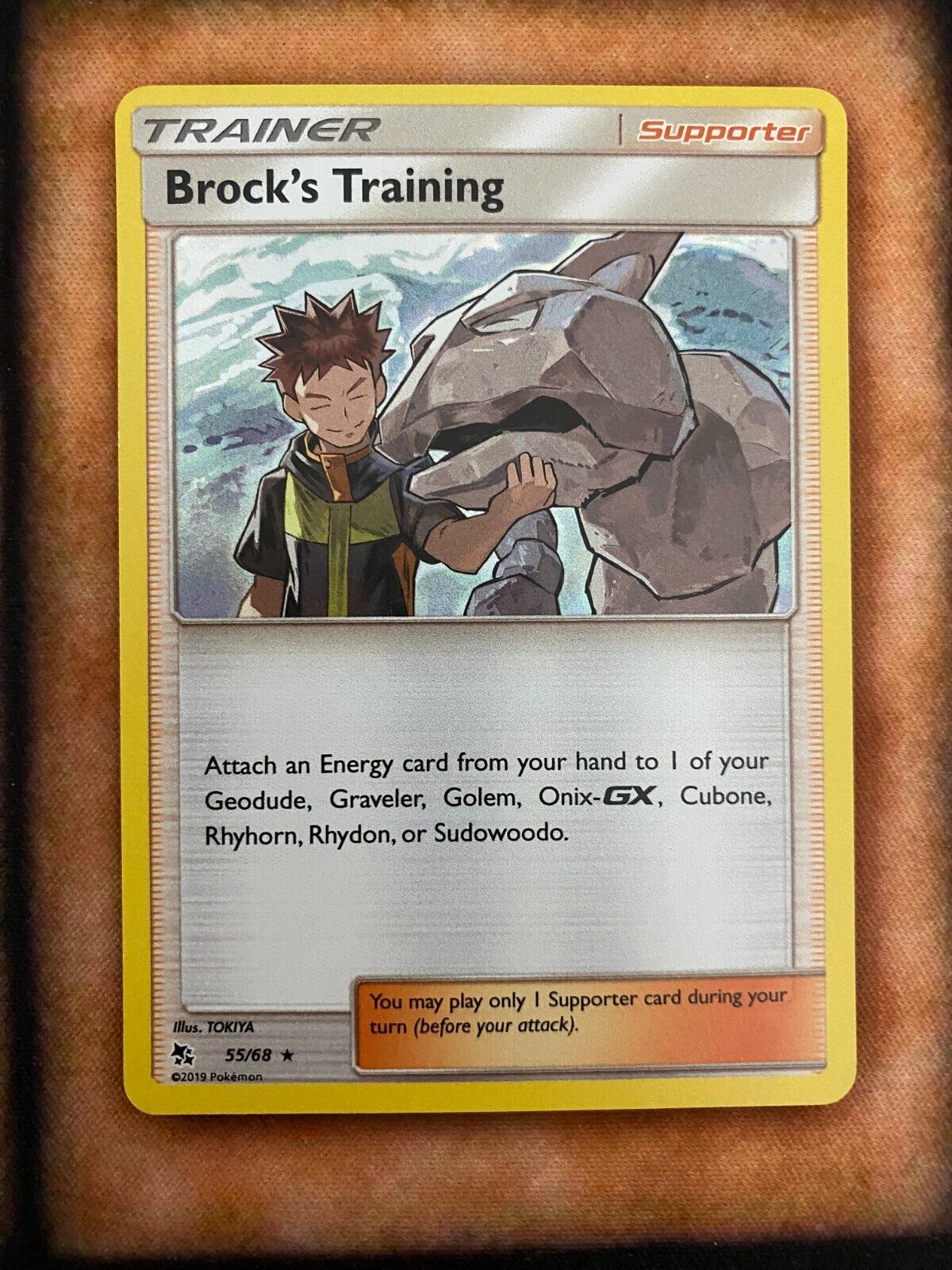 Pokemon Brock's Training 55/68 Hidden Fates Holo NM/MINT