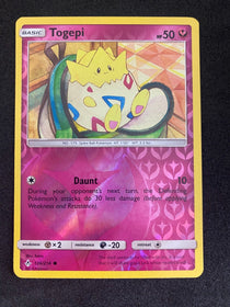 Pokemon Togepi 136/214 Unbroken Bonds Reverse Holo NM-MINT