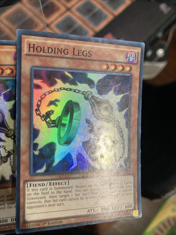 Yugioh Holding Legs MIL1-EN004 Super Rare 1st Edition HP/MP