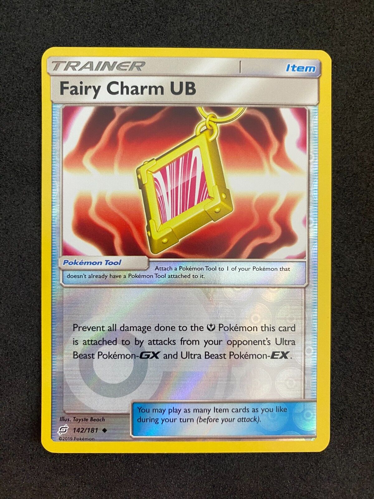 Pokemon Fairy Charm UB 142/181 Team Up Reverse Holo NM